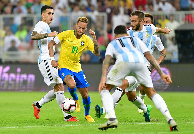 International Friendly Brazil vs Argentina: Neymar dribbling past Argentine defenders during the Saudi Superclasico