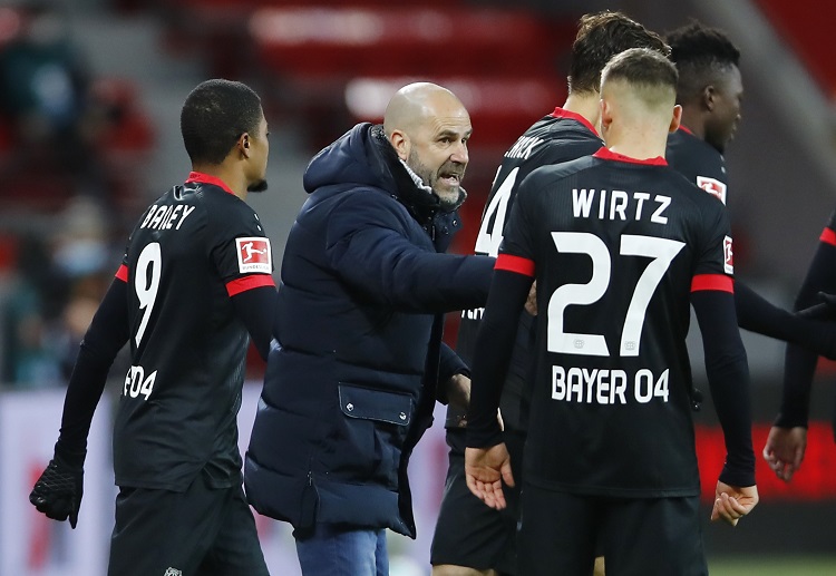 Bayer Leverkusen coach Peter Bosz instructs Wirtz during their Bundesliga game vs TSG 1899 Hoffenheim