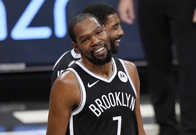 Brooklyn Nets’ Kevin Durant and Kyrie Irving are looking happy during the NBA match