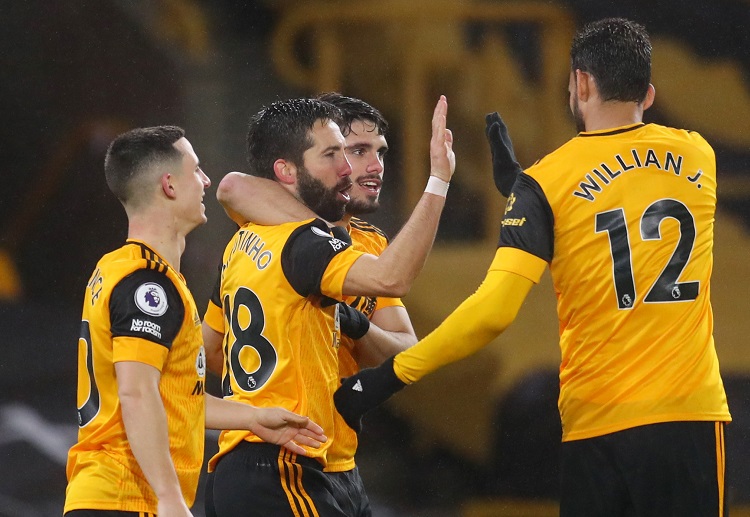 Joao Moutinho celebrates with his Wolves teammates after scoring a Premier League goal