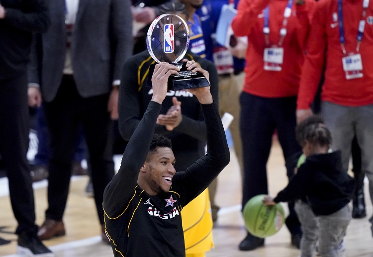 Giannis Antetokounmpo lifting the trophy after the NBA All-Star game